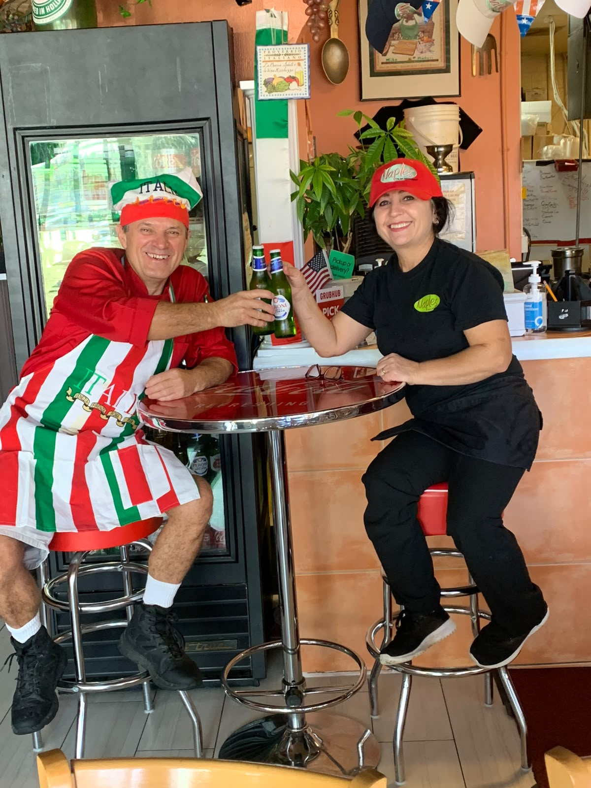 Mike and Suzana toasting at the family restaurant