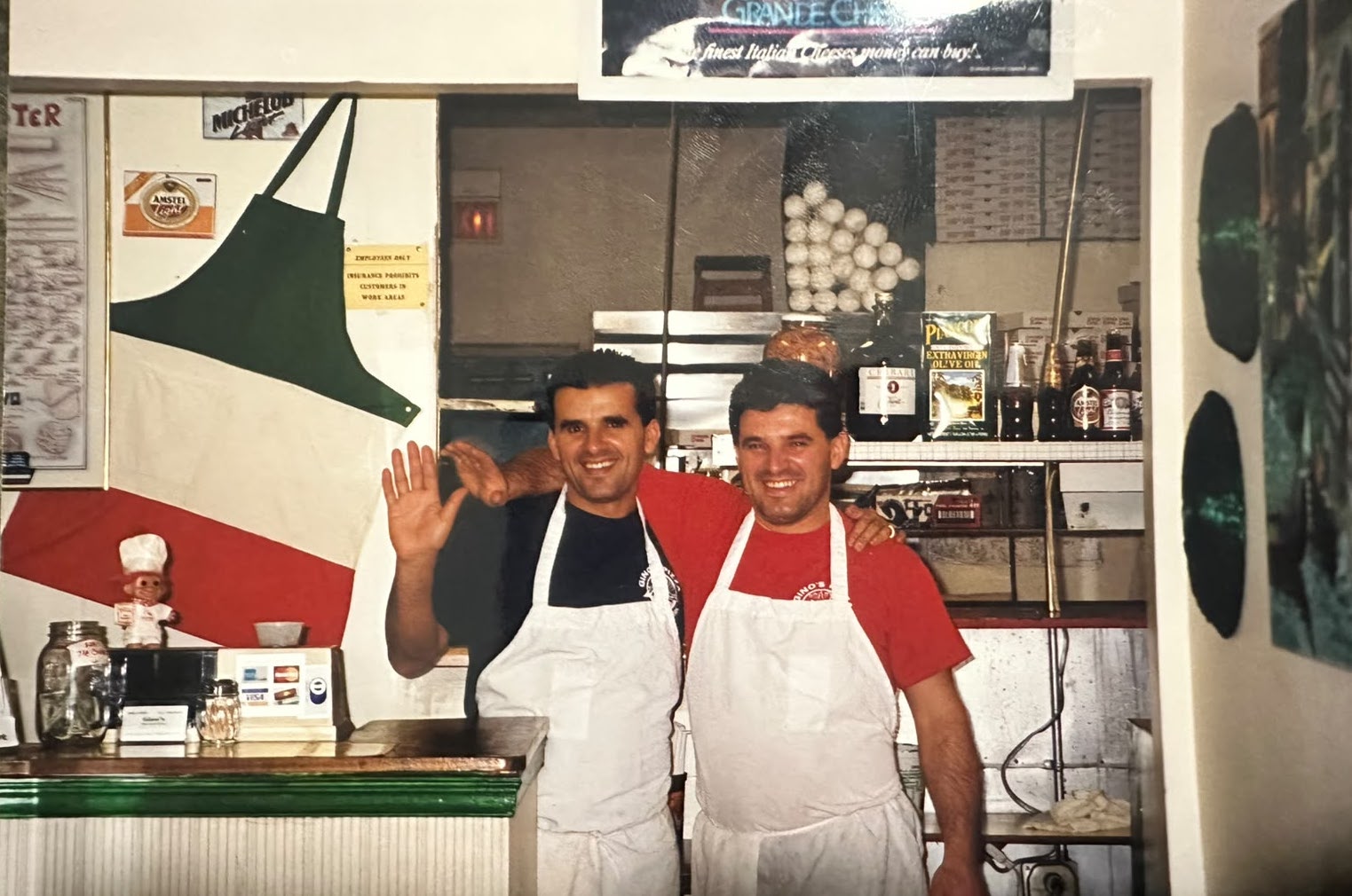 The father and his brothers behind the counter of their New York restaurant